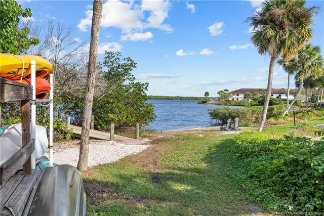 a view of a patio with chairs and a table