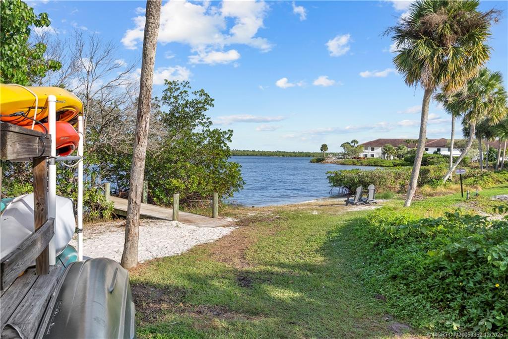 5313 Southeast Miles Grant Road, Unit K209 Stuart, FL 34997 - Photo 23 of 34 a view of swimming pool with lawn chairs and plants