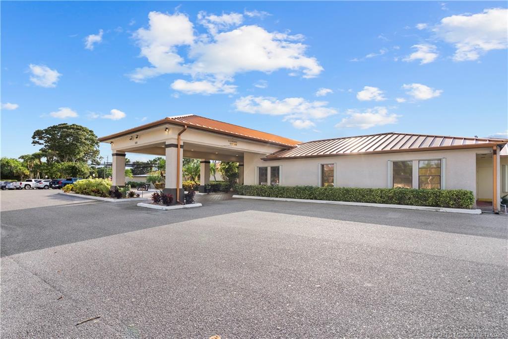 5313 Southeast Miles Grant Road, Unit K209 Stuart, FL 34997 - Photo 27 of 34 a view of a building and a street