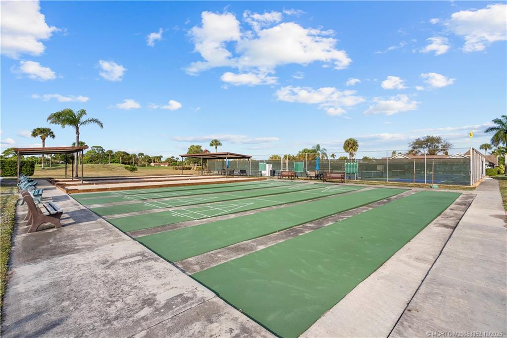 5313 Southeast Miles Grant Road, Unit K209 Stuart, FL 34997 - Photo 30 of 34 a view of a playground and yard