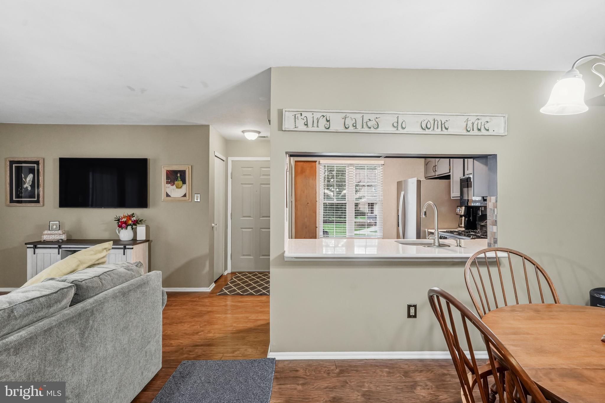 3305A Ramsbury Court Mount Laurel, NJ 08054 - Photo 11 of 27 a view of a dining room with furniture window and wooden floor