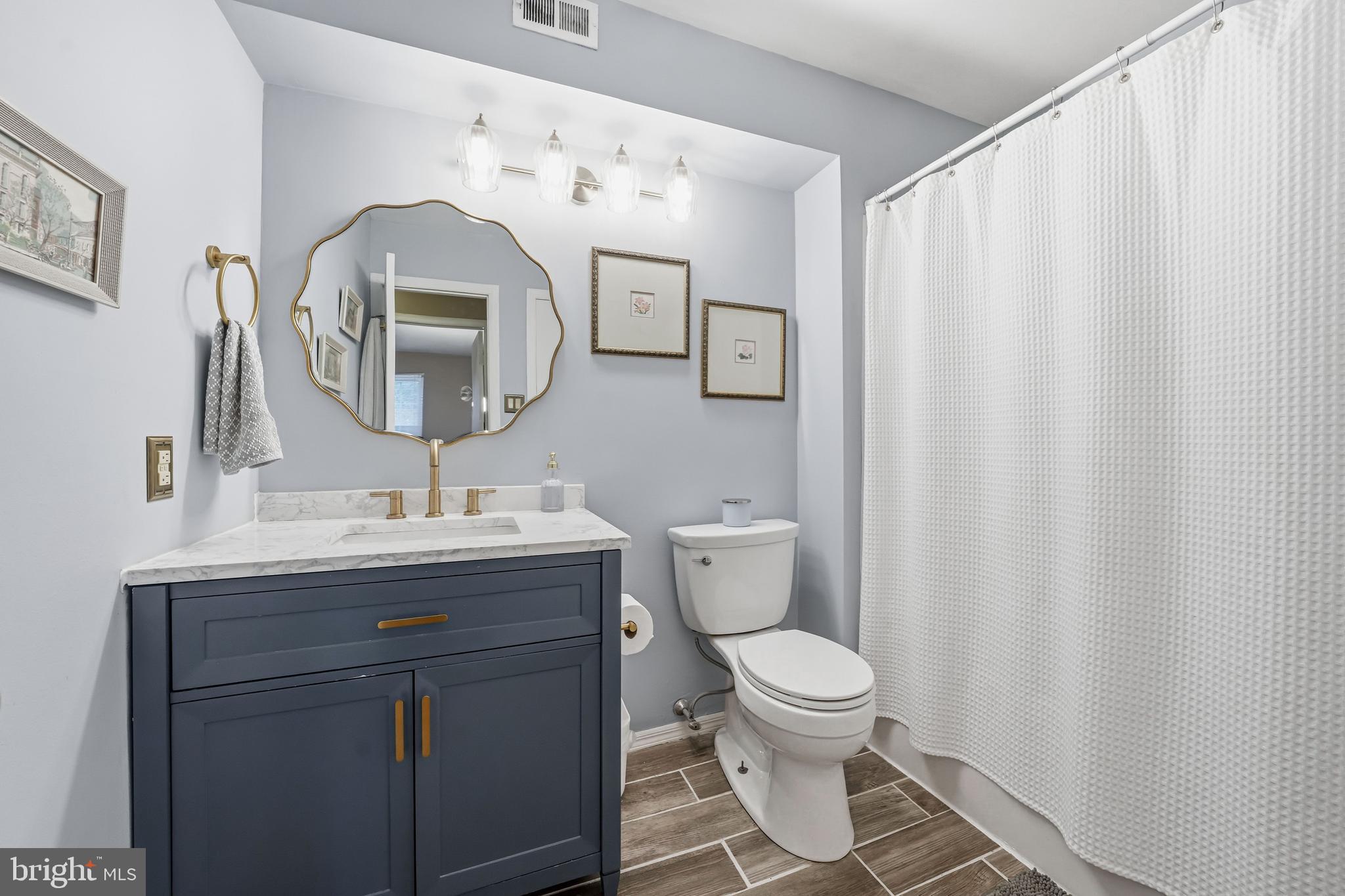 3305A Ramsbury Court Mount Laurel, NJ 08054 - Photo 17 of 27 a bathroom with a toilet a sink and a mirror