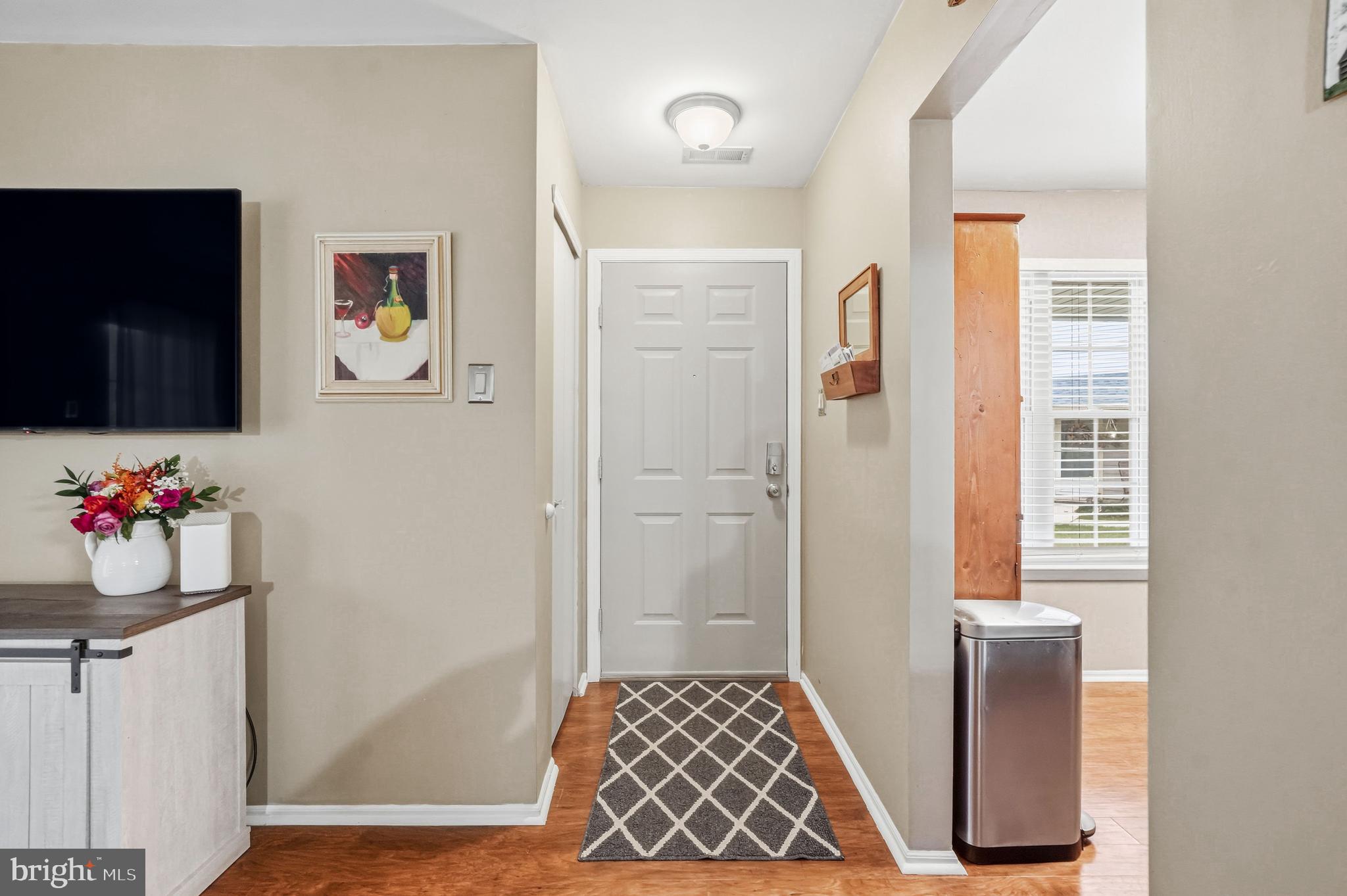 3305A Ramsbury Court Mount Laurel, NJ 08054 - Photo 5 of 27 a hallway with table and mirror