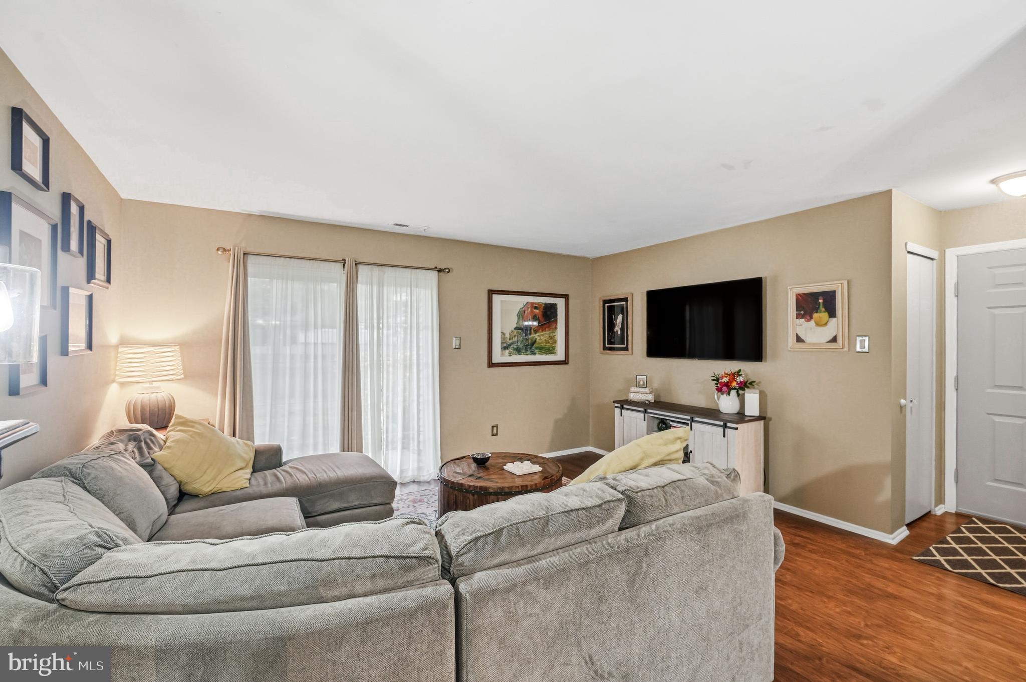 3305A Ramsbury Court Mount Laurel, NJ 08054 - Photo 8 of 27 a living room with furniture and a flat screen tv
