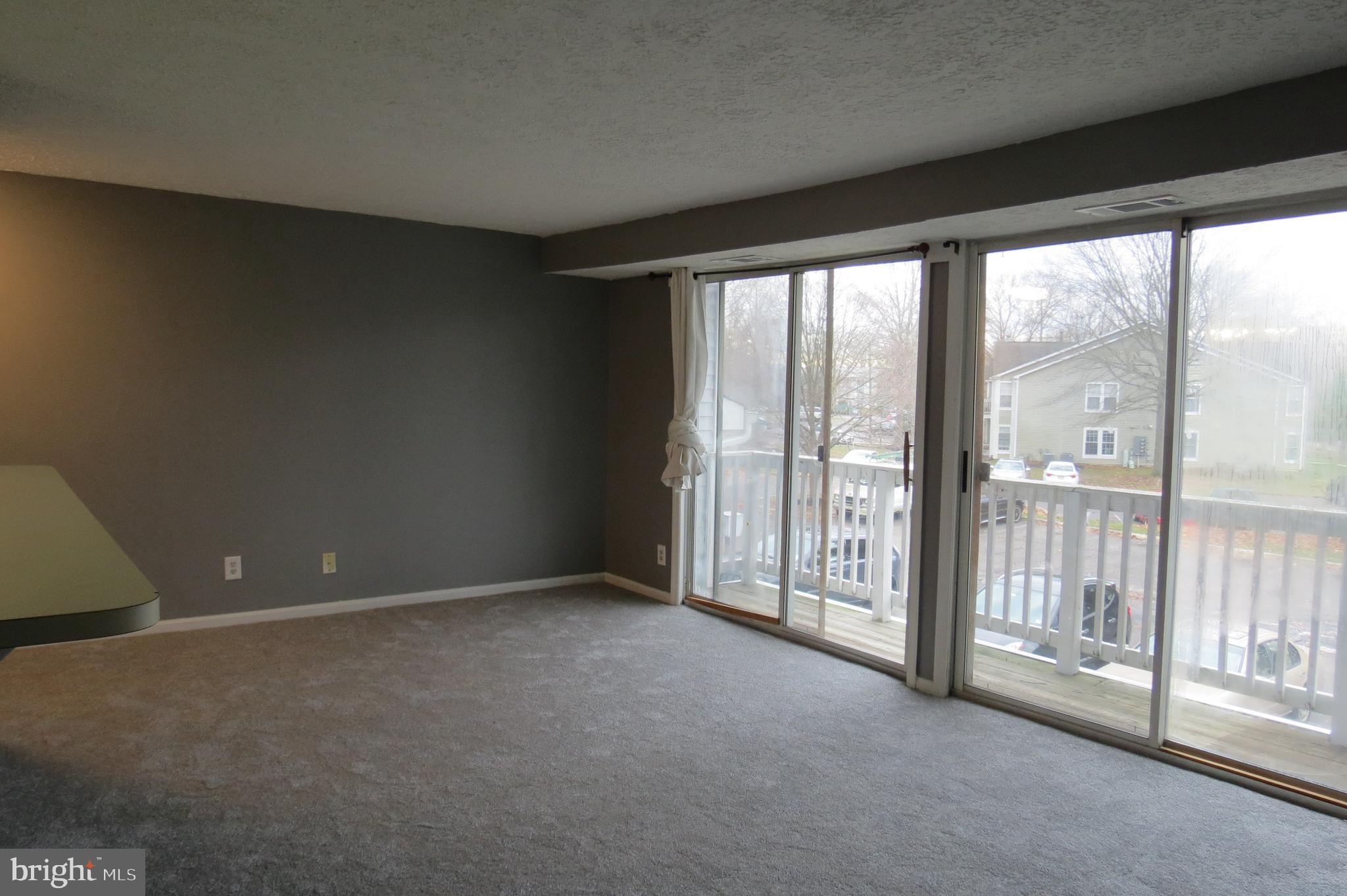 153 Kenwood Drive Sicklerville, NJ 08081 - Photo 2 of 13 a view of an empty room with windows