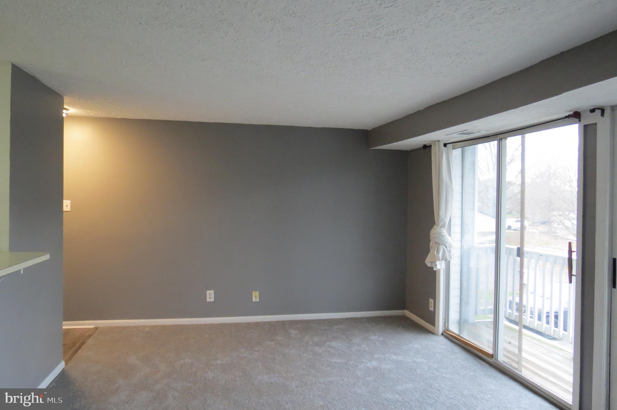 153 Kenwood Drive Sicklerville, NJ 08081 - Photo 4 of 13 an empty room with windows