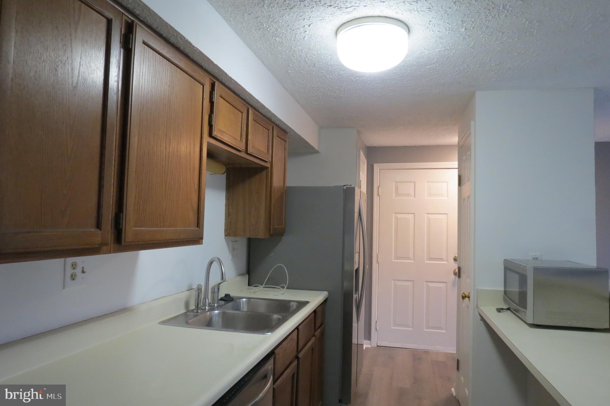 153 Kenwood Drive Sicklerville, NJ 08081 - Photo 5 of 13 a bathroom with a sink and a mirror