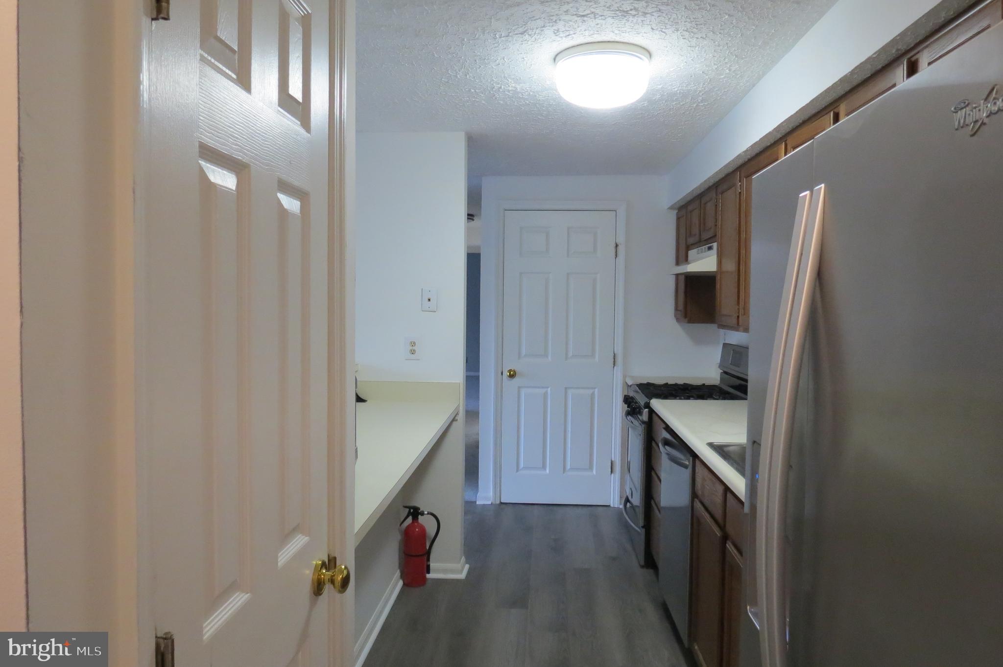 153 Kenwood Drive Sicklerville, NJ 08081 - Photo 6 of 13 a kitchen with granite countertop a sink and stainless steel appliances