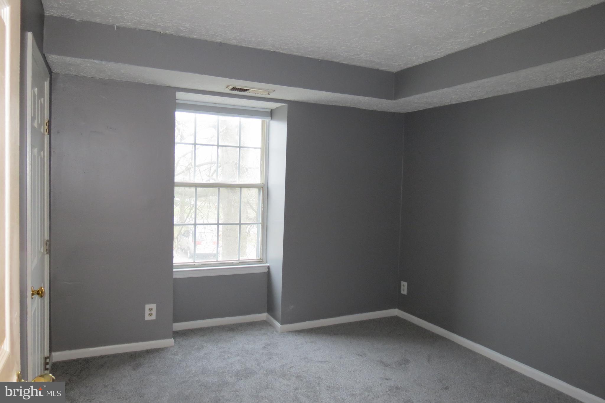 153 Kenwood Drive Sicklerville, NJ 08081 - Photo 10 of 13 an empty room with windows