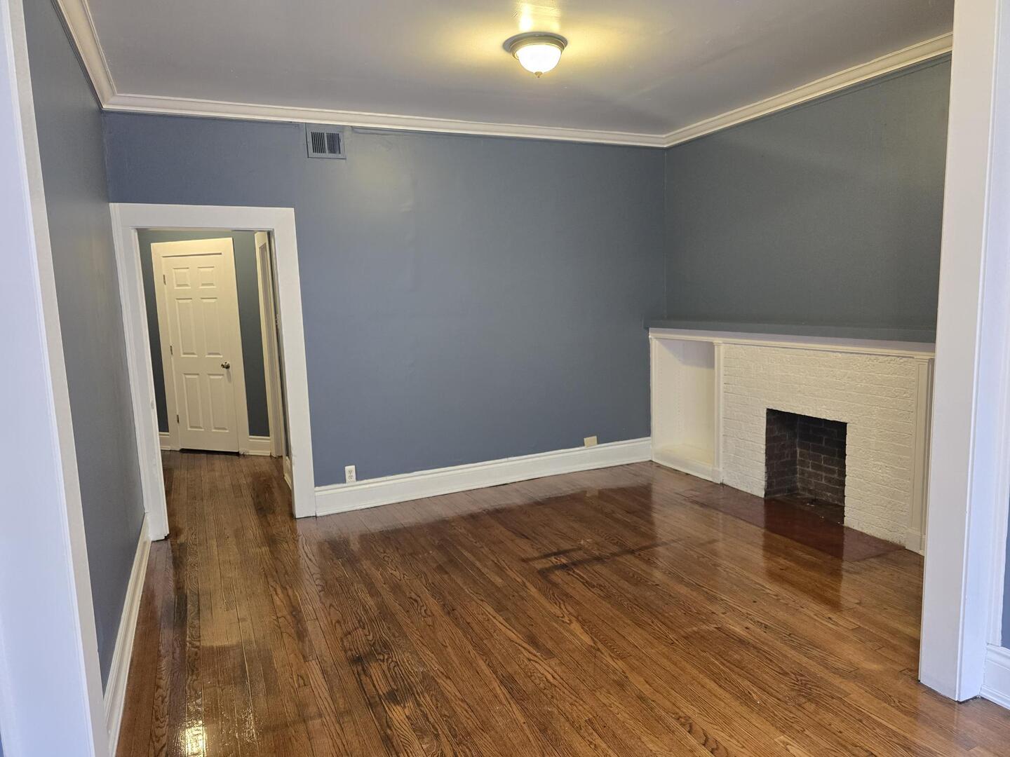 7317 South Union Avenue Chicago, IL 60621 - Photo 11 of 26 a view of empty room with wooden floor