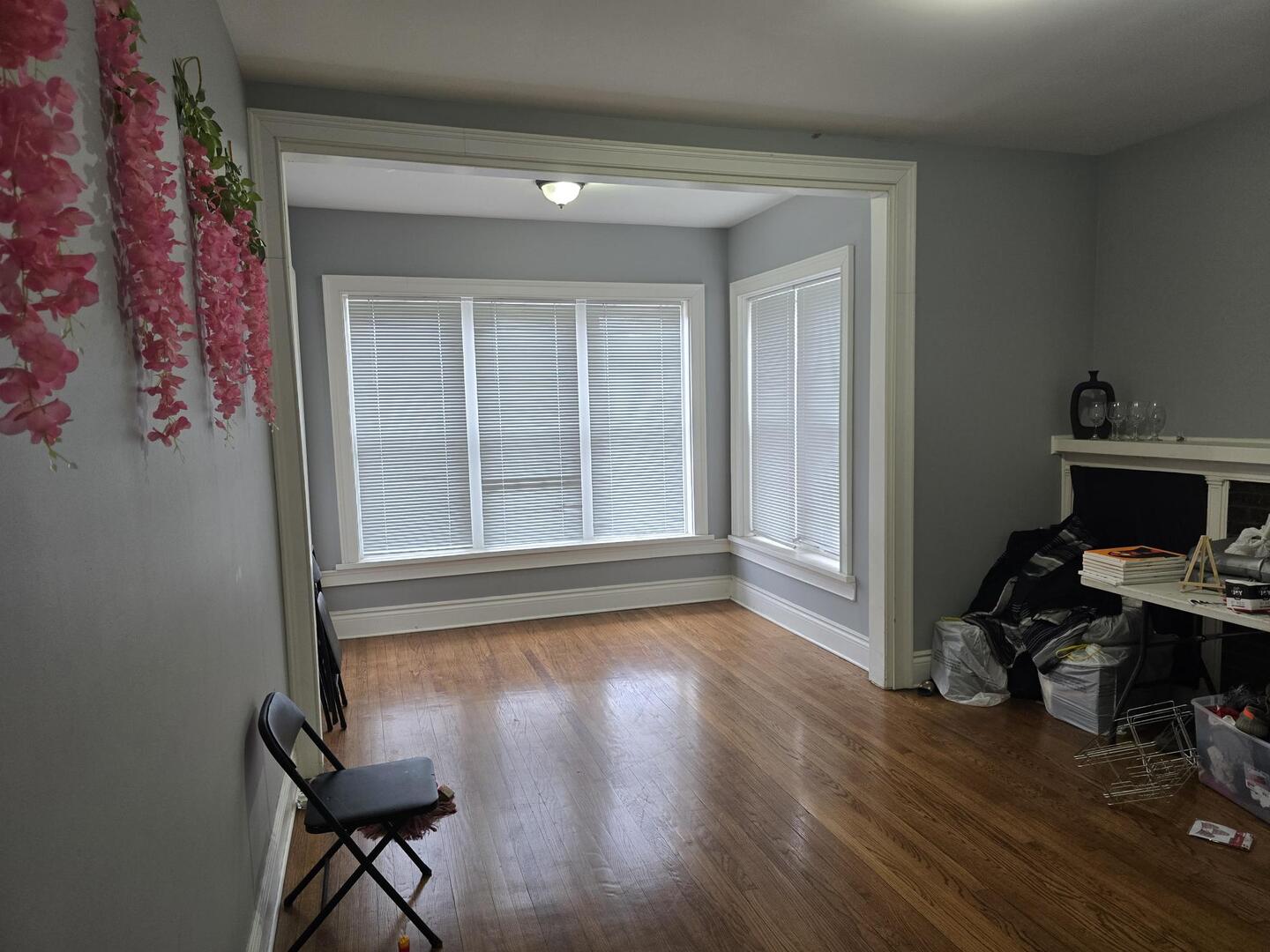 7317 South Union Avenue Chicago, IL 60621 - Photo 14 of 26 a view of a workspace with wooden floor and a window