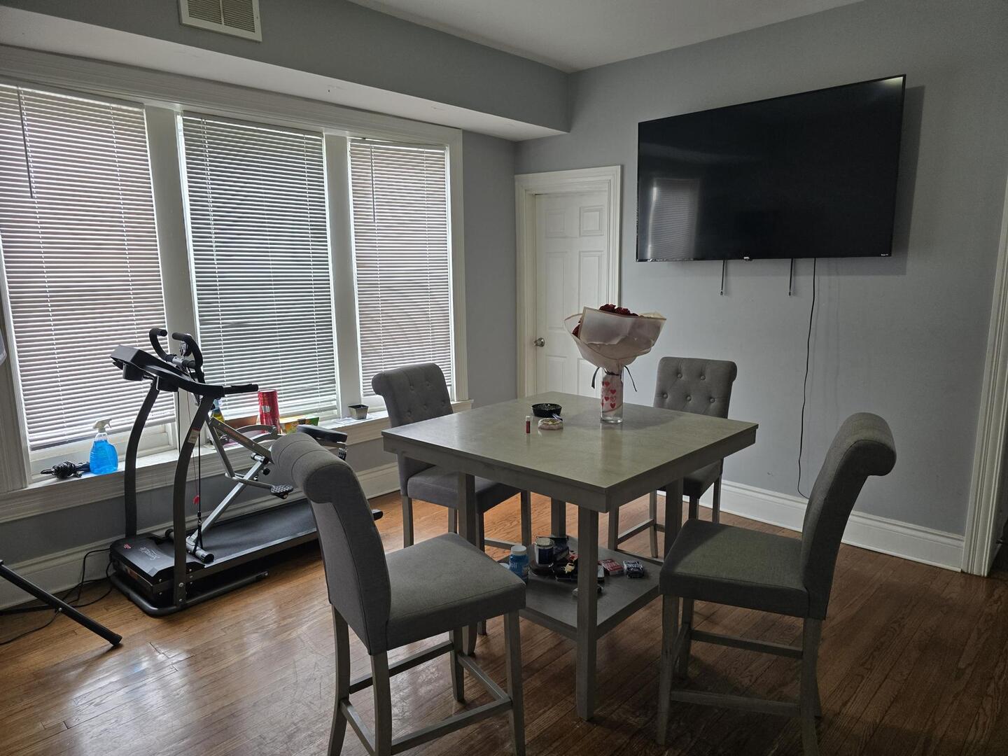7317 South Union Avenue Chicago, IL 60621 - Photo 16 of 26 a view of a dining room with furniture and a flat screen tv