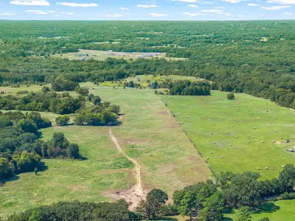 a view of a lake with a yard