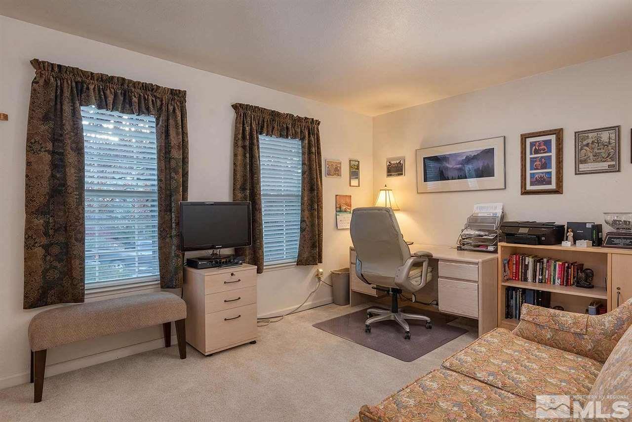4811 East Creek Ridge Trail Reno, NV 89519 - Photo 14 of 25 a view of a workspace with furniture and a window