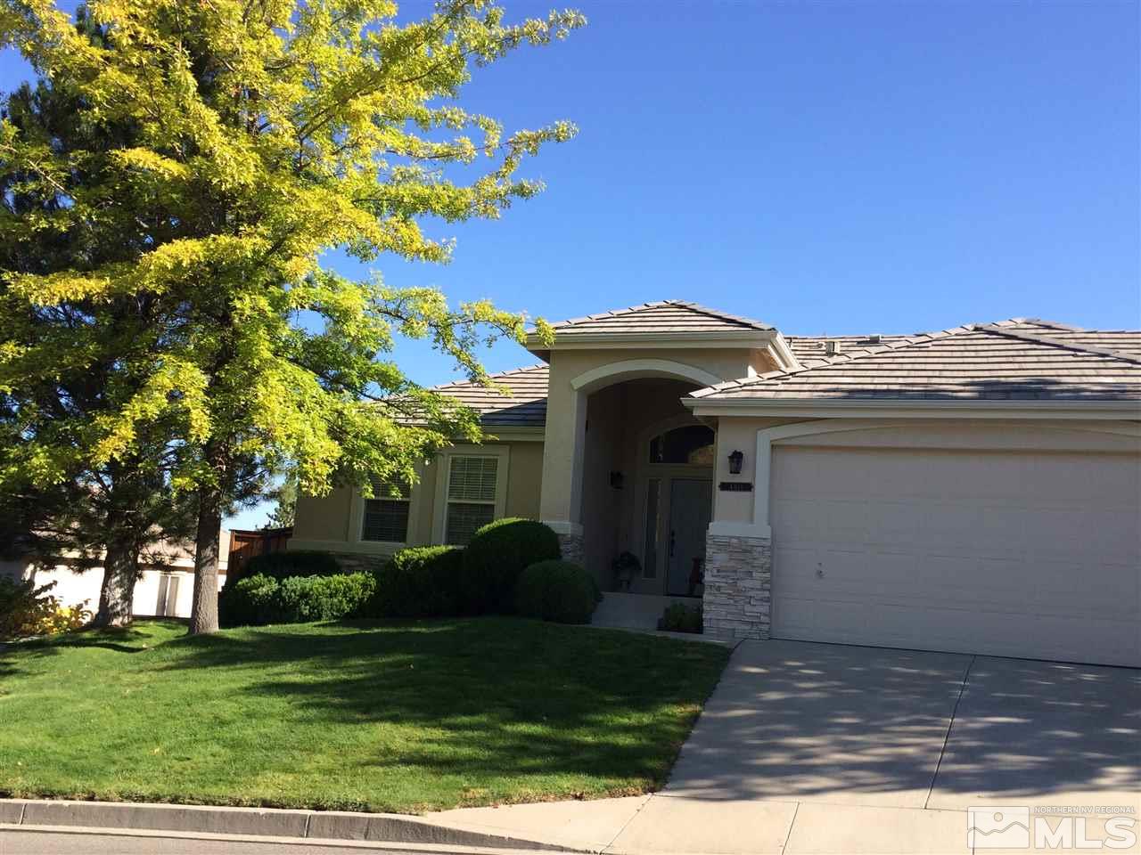 4811 East Creek Ridge Trail Reno, NV 89519 - Photo 19 of 25 a view of a house with a small yard