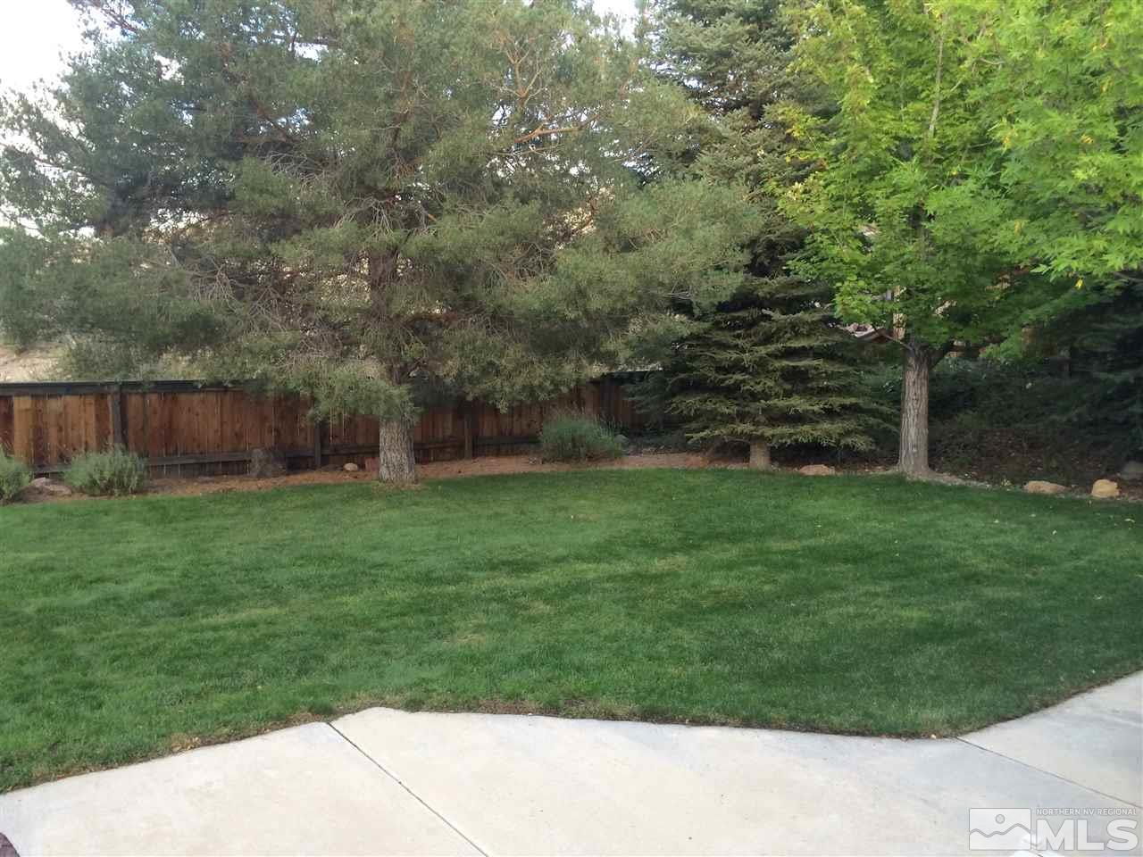 4811 East Creek Ridge Trail Reno, NV 89519 - Photo 20 of 25 a view of a backyard with a garden