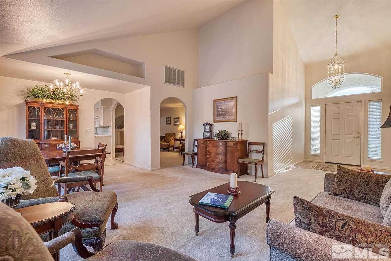 4811 East Creek Ridge Trail Reno, NV 89519 - Photo 2 of 25 a living room with furniture and wooden floor