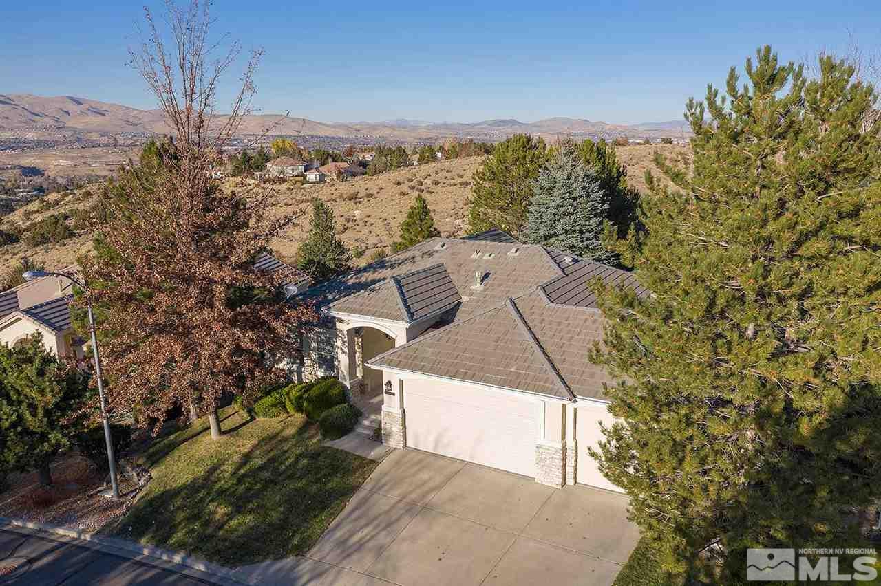 4811 East Creek Ridge Trail Reno, NV 89519 - Photo 6 of 25 a view of a house with a yard