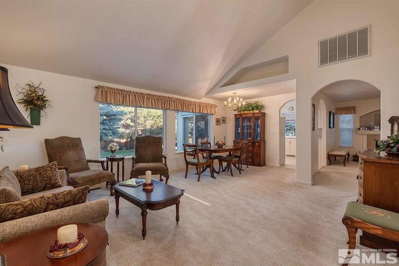 4811 East Creek Ridge Trail Reno, NV 89519 - Photo 8 of 25 a living room with furniture and a large window