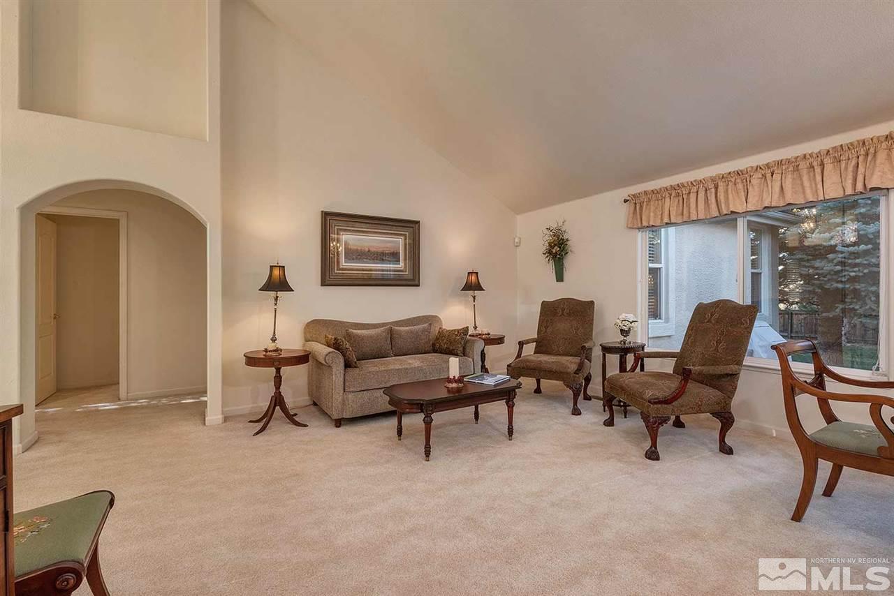 4811 East Creek Ridge Trail Reno, NV 89519 - Photo 9 of 25 a living room with furniture and a window