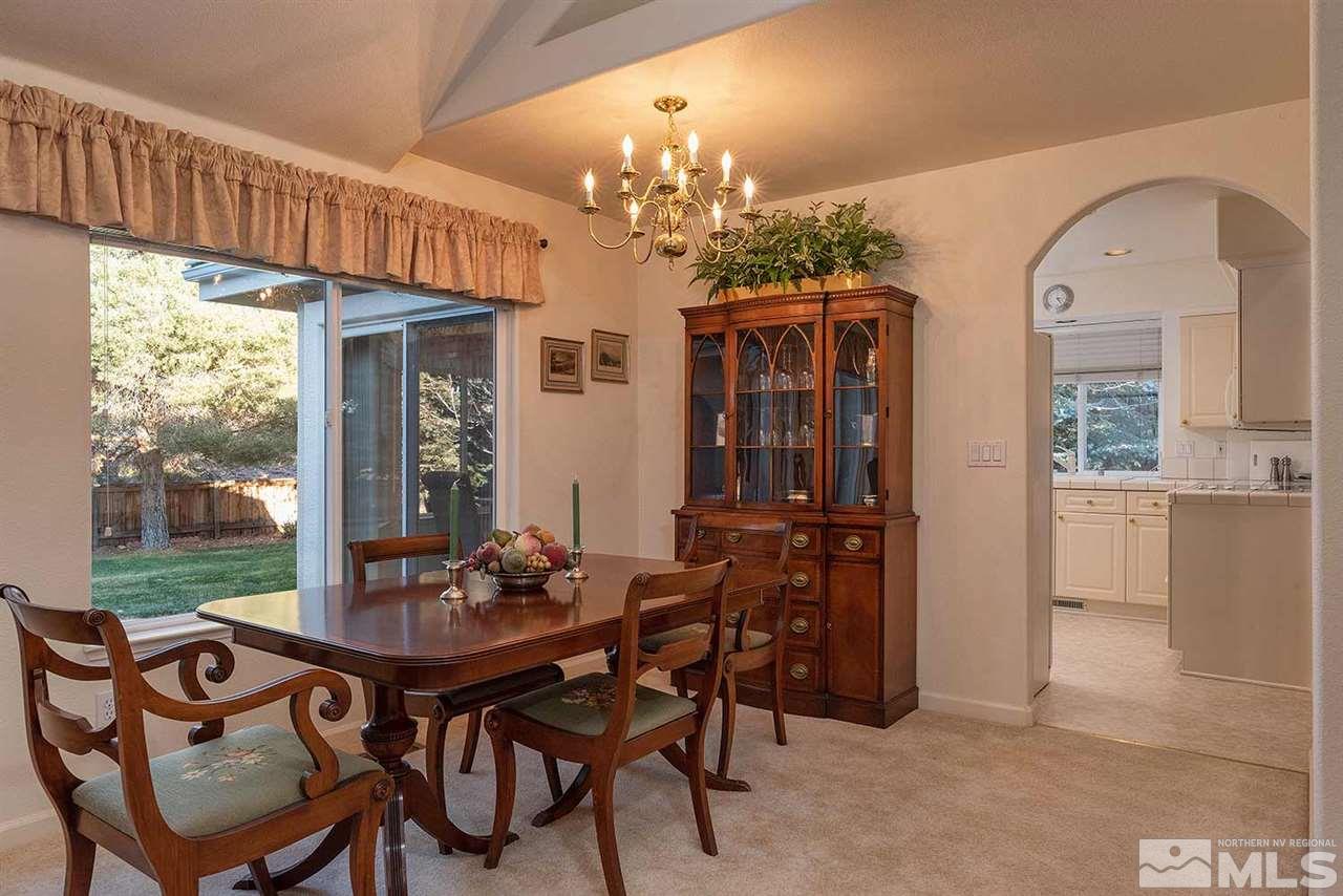 4811 East Creek Ridge Trail Reno, NV 89519 - Photo 10 of 25 a view of a dining room with furniture window and outside view