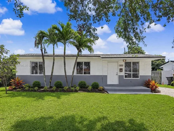 front view of a house with a yard