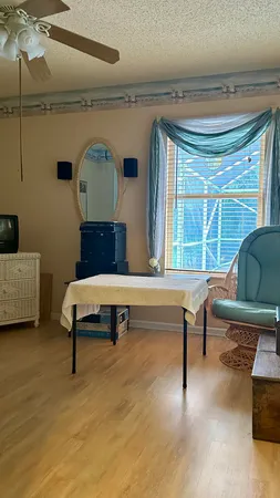 a living room with furniture and a window