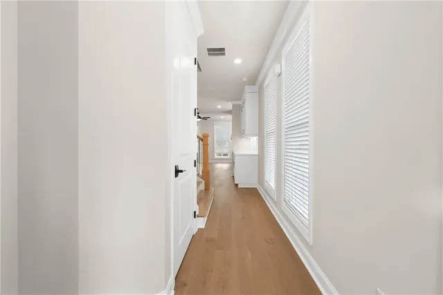 a view of a hallway with a white walls