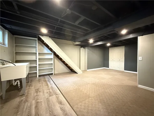 a bathroom with a sink mirror vanity and toilet