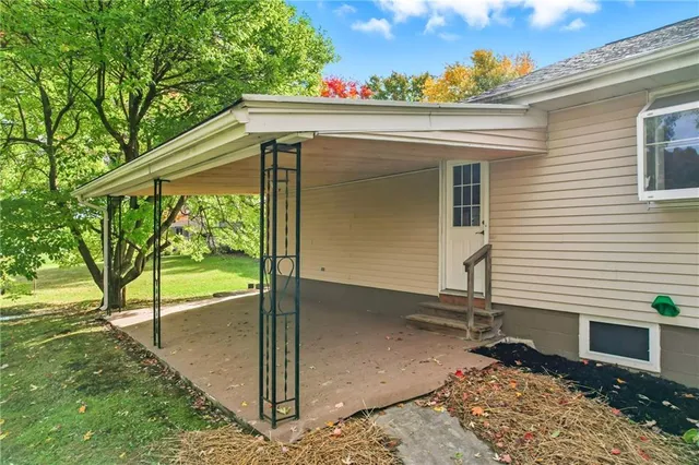 a view of house with backyard