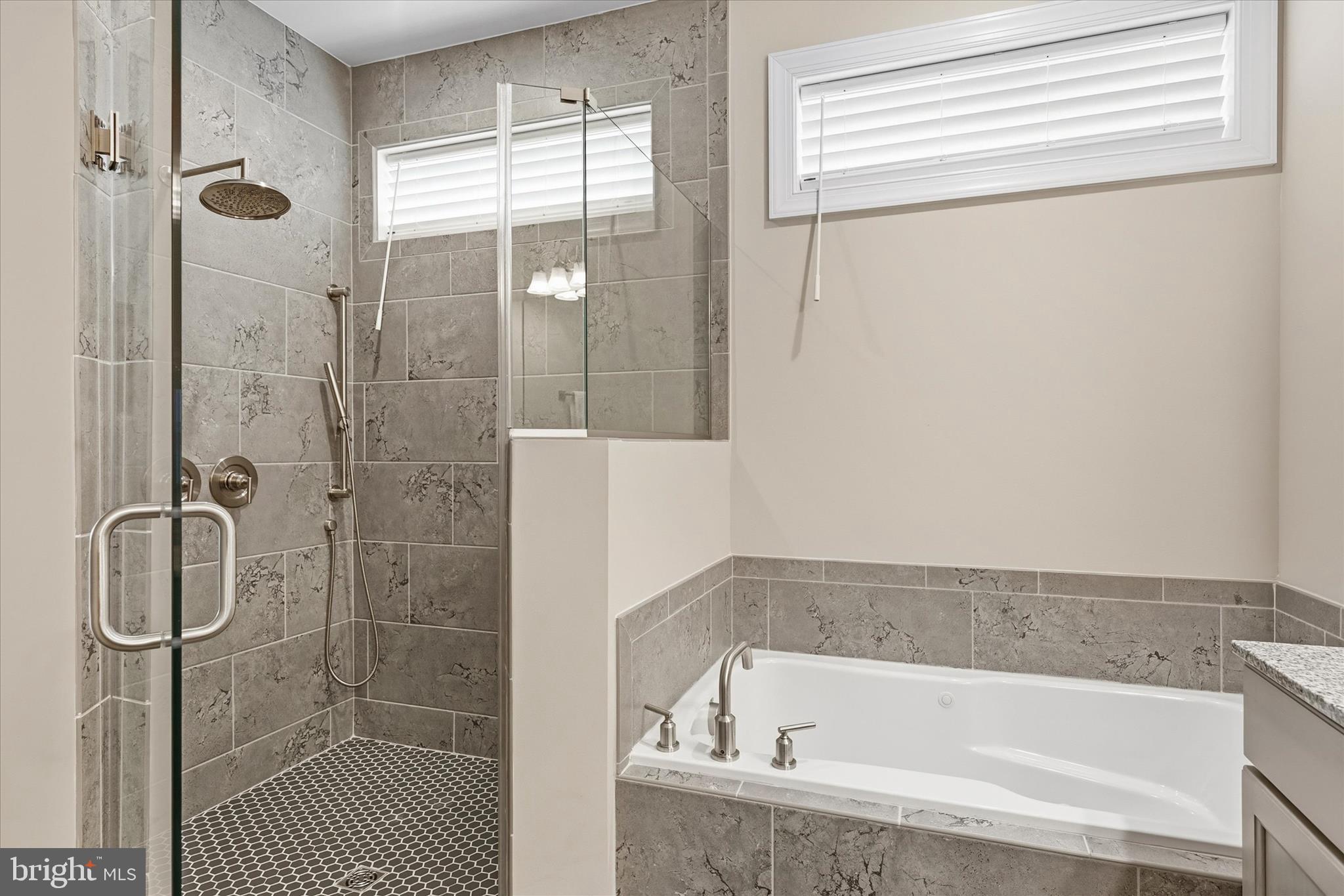 30475 Madeira Lane Ocean View, DE 19970 - Photo 17 of 31 a bathroom with a bath tub and shower
