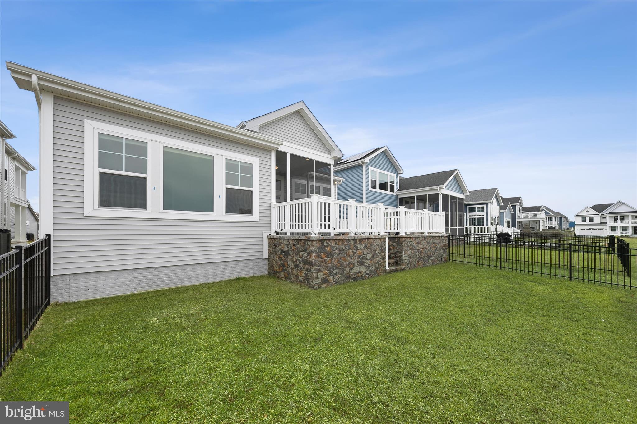 30475 Madeira Lane Ocean View, DE 19970 - Photo 27 of 31 a view of a house with a yard and sitting area