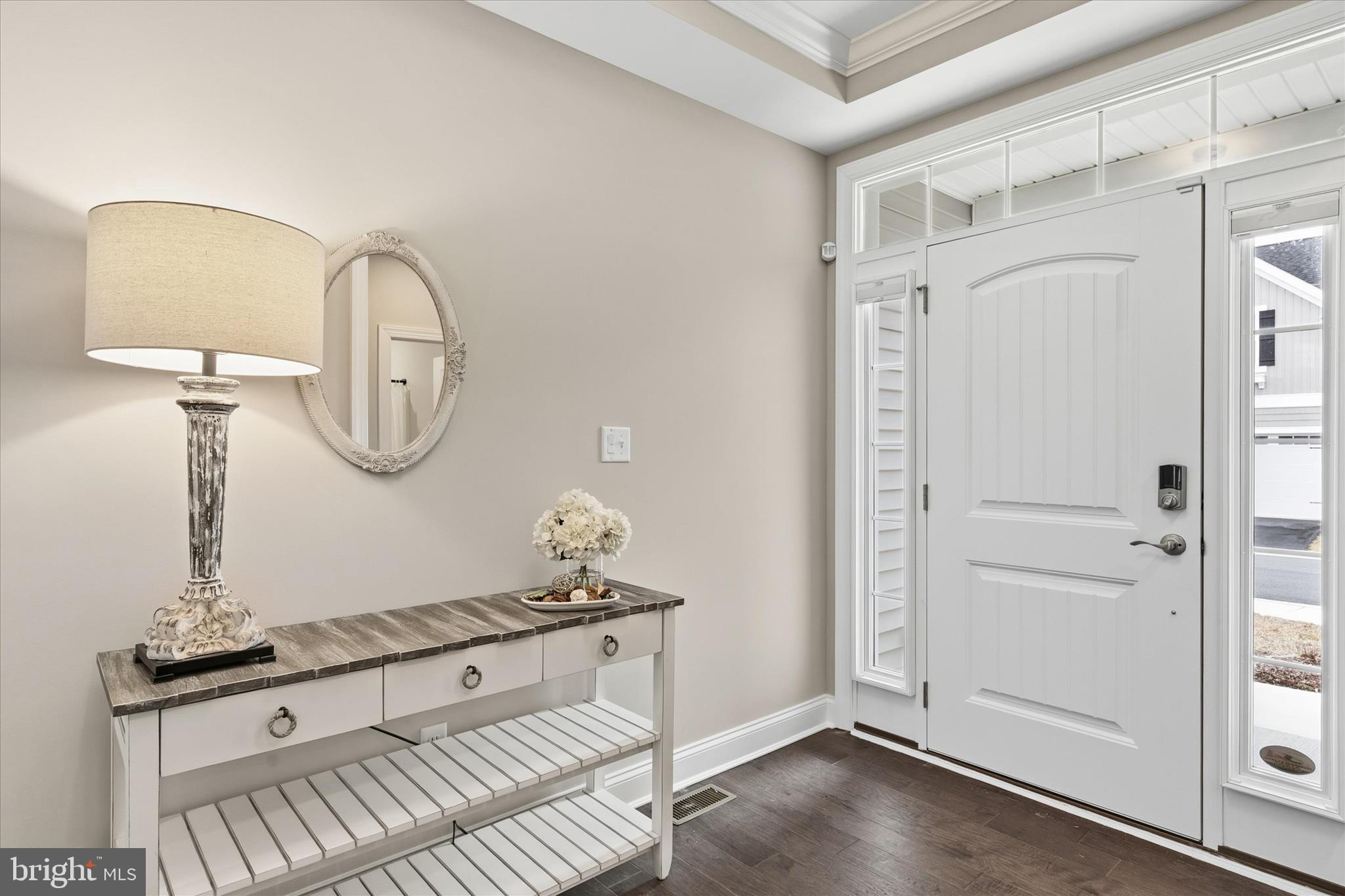 30475 Madeira Lane Ocean View, DE 19970 - Photo 3 of 38 a view of a room that has a mirror and a wooden floor