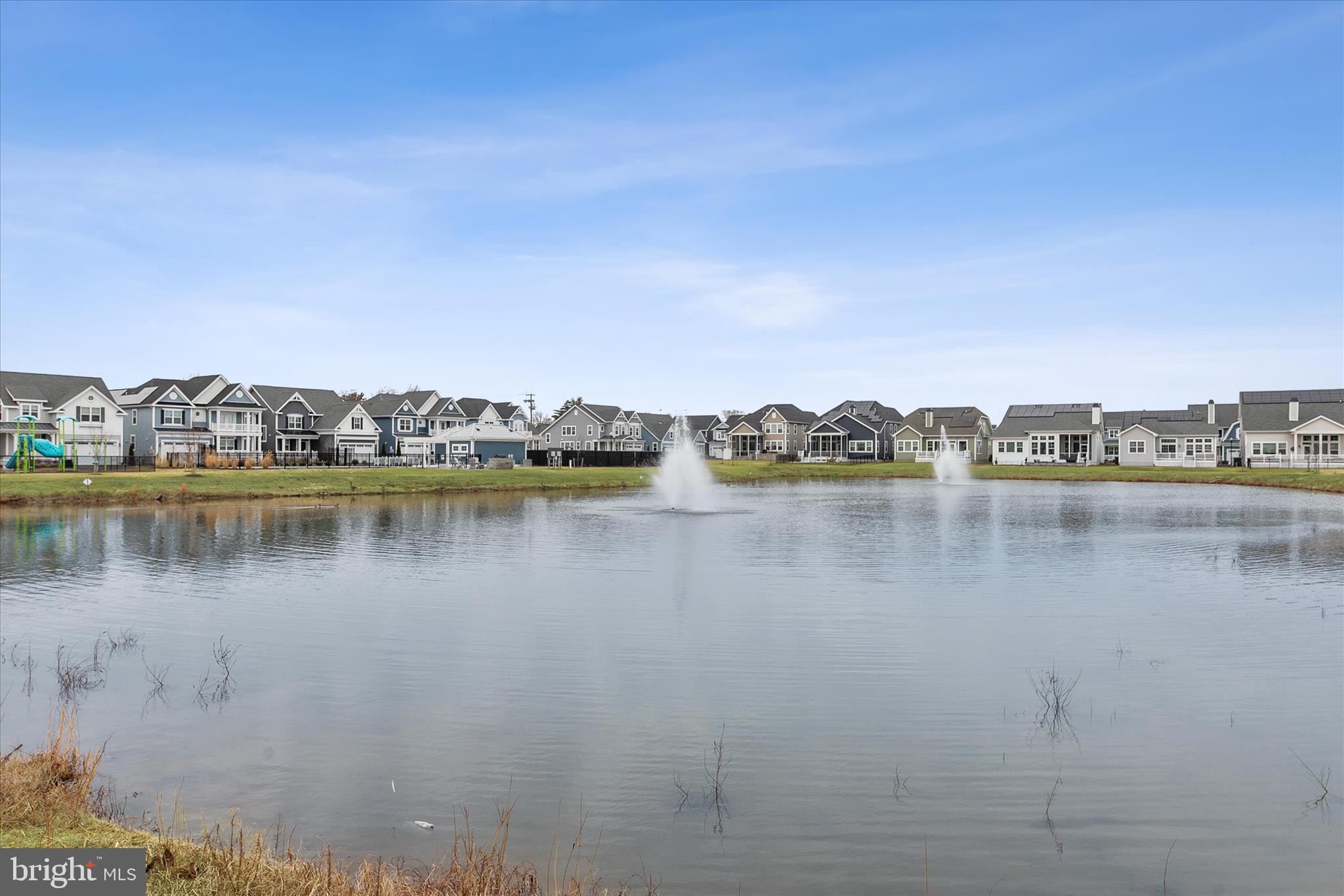 30475 Madeira Lane Ocean View, DE 19970 - Photo 32 of 38 a view of a lake with houses in the back