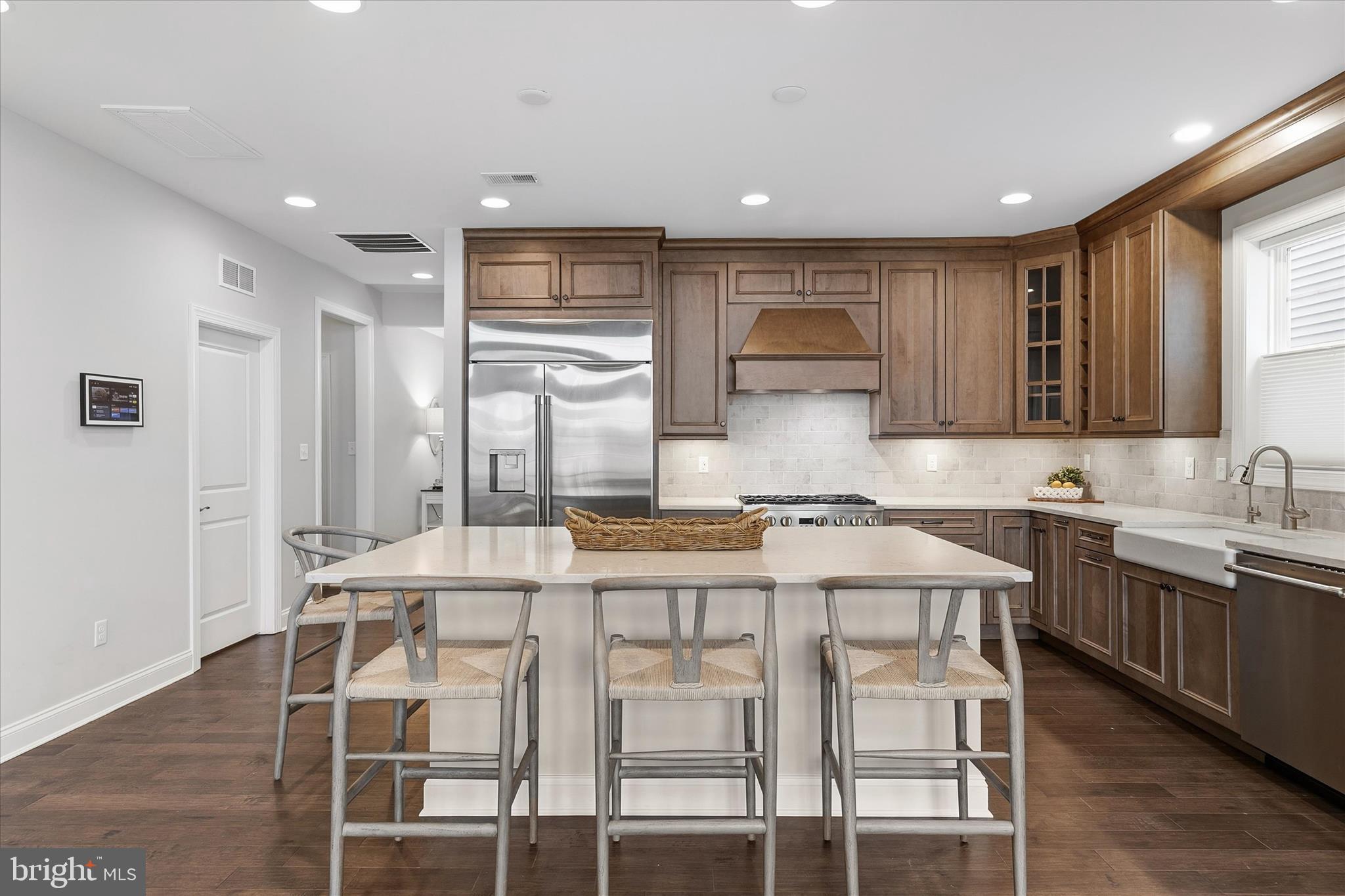30475 Madeira Lane Ocean View, DE 19970 - Photo 9 of 38 a kitchen with a table chairs sink and cabinets