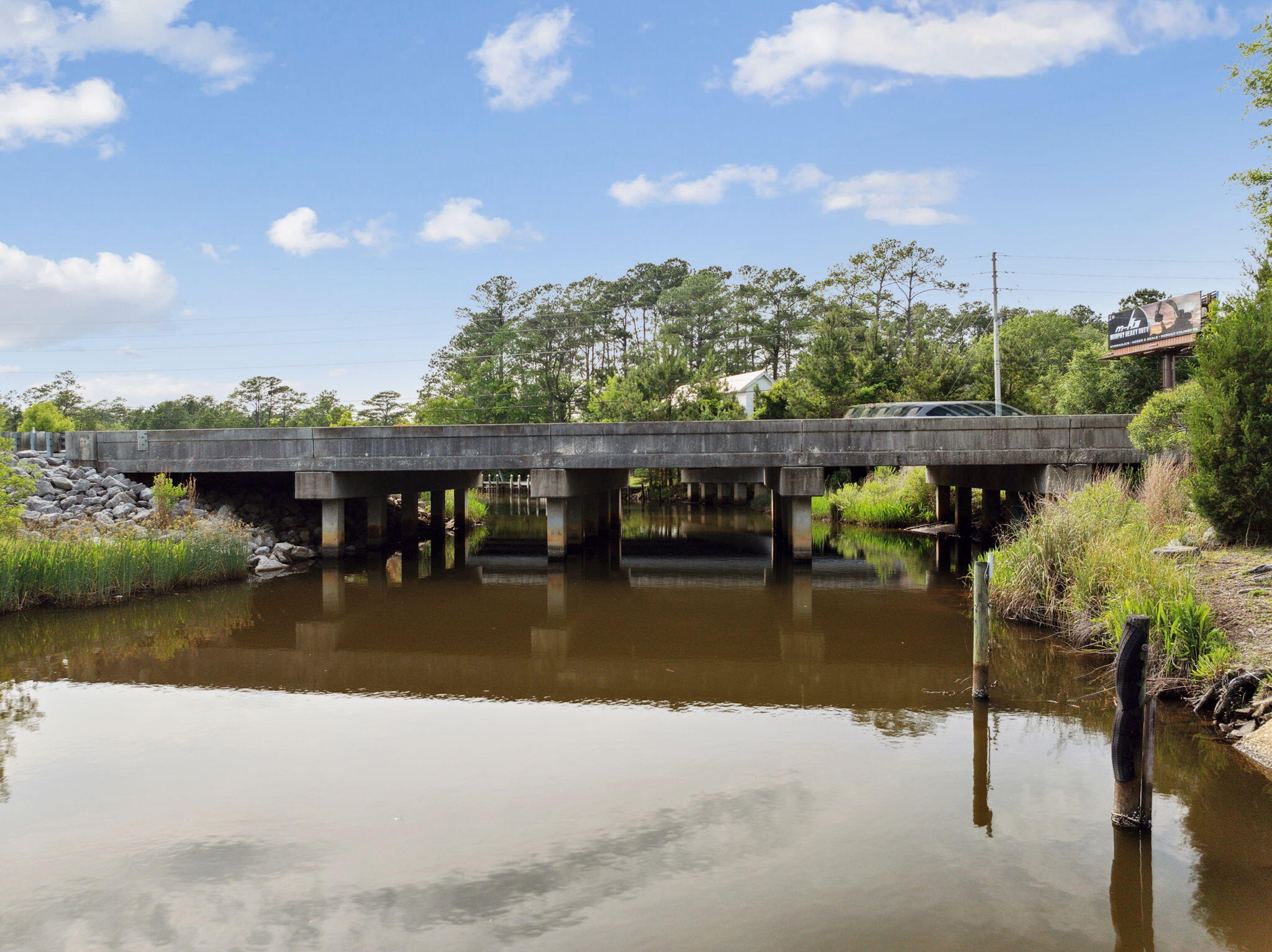 193 Ramsey Br Road Freeport, FL 32439 - Photo 16 of 25 a balcony with furniture and a lake view