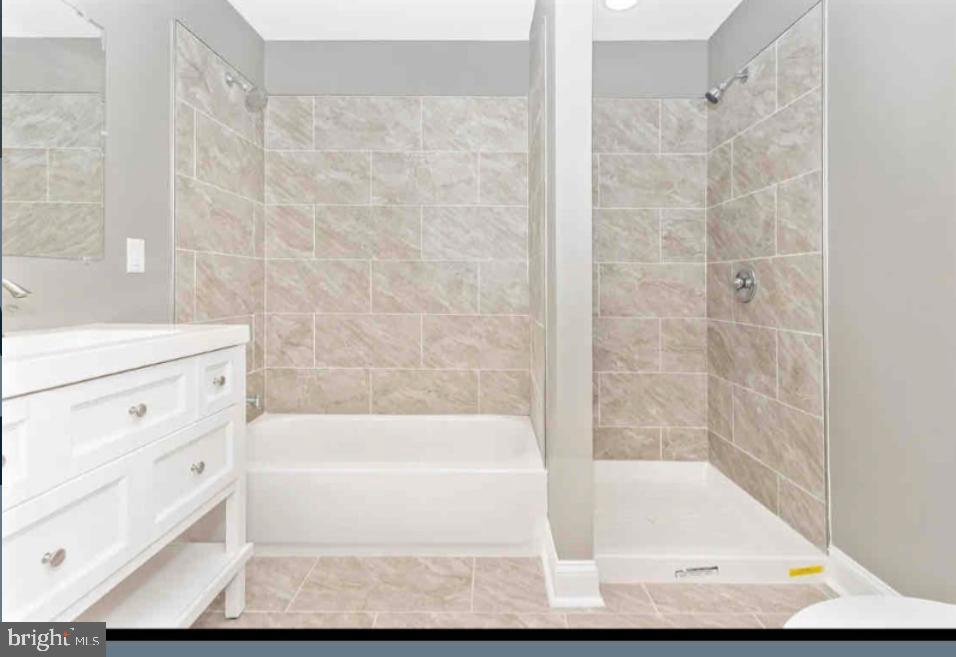 1112 Rutland Avenue Baltimore, MD 21213 - Photo 11 of 22 a bathroom with a bathtub and shower