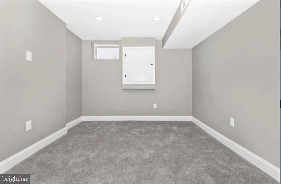 1112 Rutland Avenue Baltimore, MD 21213 - Photo 18 of 22 a view of an empty room with a window