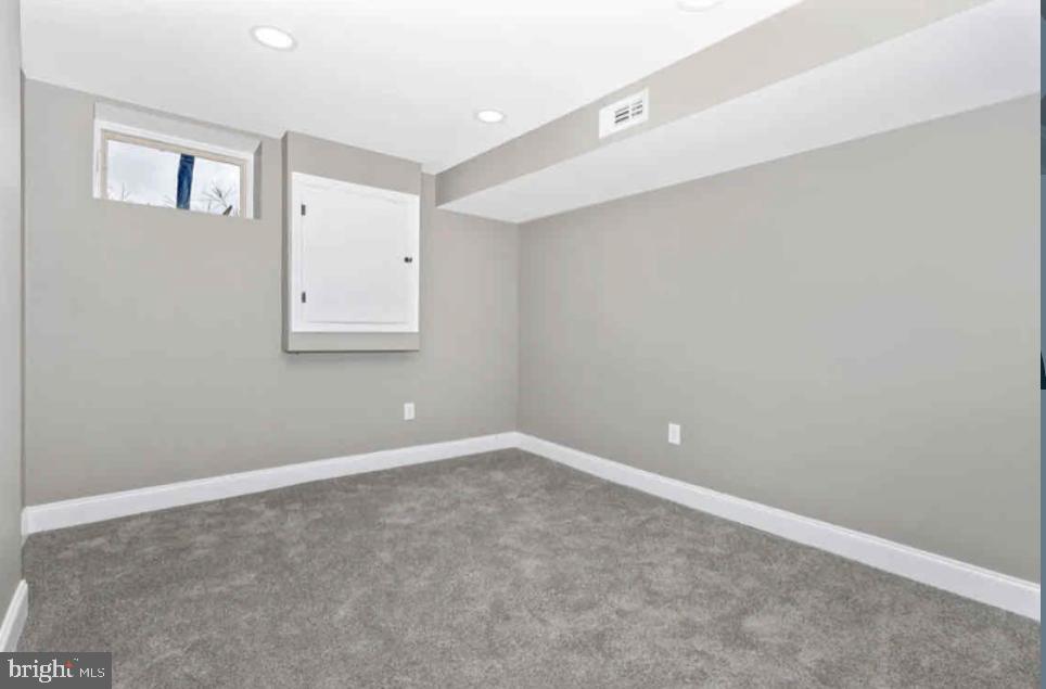 1112 Rutland Avenue Baltimore, MD 21213 - Photo 19 of 22 an empty room with a workbench