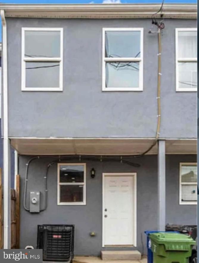 1112 Rutland Avenue Baltimore, MD 21213 - Photo 22 of 22 a front view of a house with a large windows
