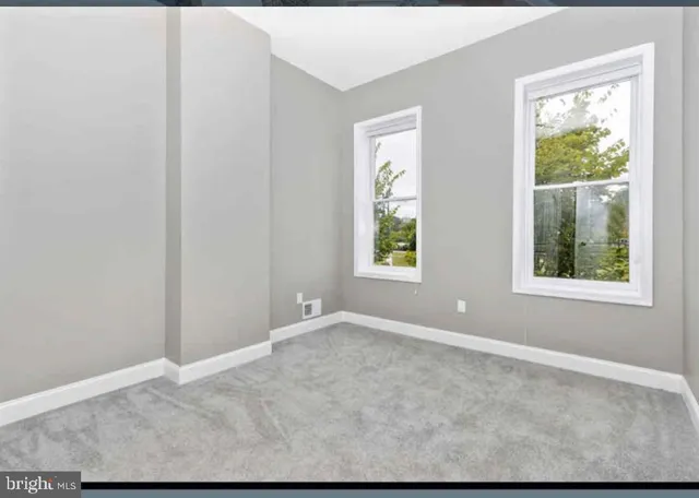 an empty room with windows