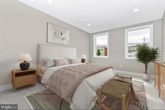 a bedroom with a bed and a potted plant