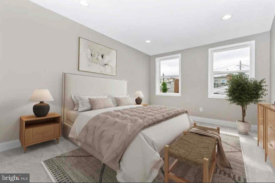 1112 Rutland Avenue Baltimore, MD 21213 - Photo 9 of 22 a bedroom with a bed and a potted plant