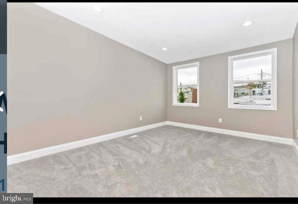 1112 Rutland Avenue Baltimore, MD 21213 - Photo 10 of 22 a view of an empty room with a window
