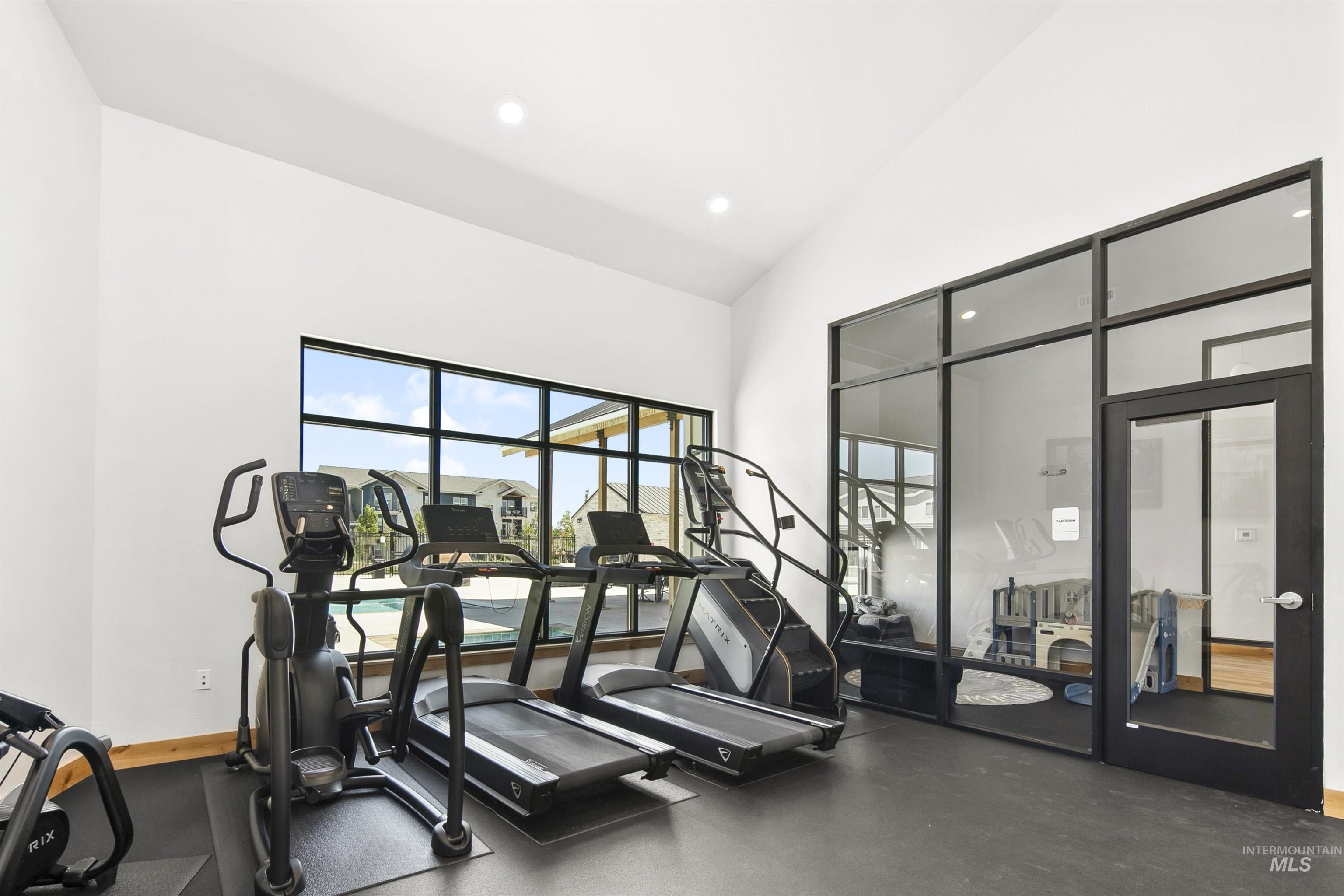 755 West Wrangler Street Meridian, ID 83646 - Photo 29 of 35 Fitness area featuring rubber flooring, recessed lighting, and a large window with black framing