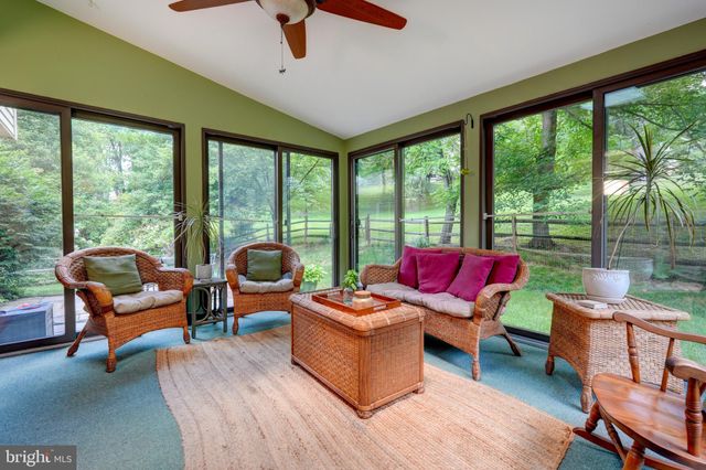 a bathroom with a sink a toilet and shower curtain