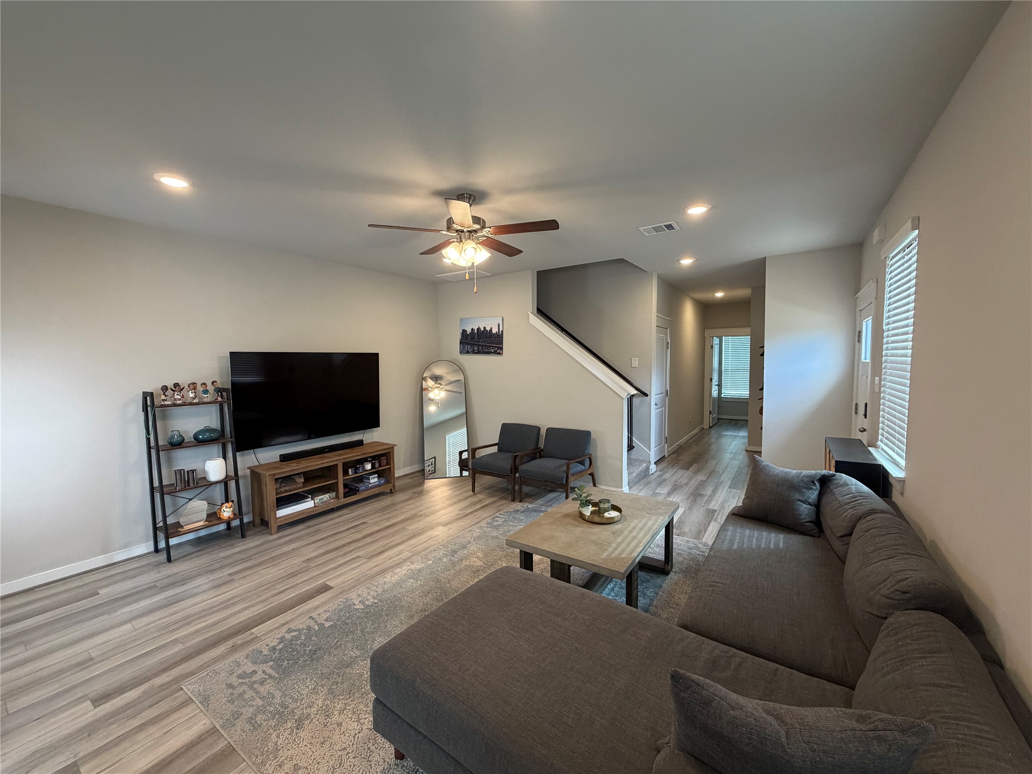 125 Threshing Road, Unit A Buda, TX 78610 - Photo 2 of 23 Living room with light wood-type flooring, recessed lighting, and ceiling fan