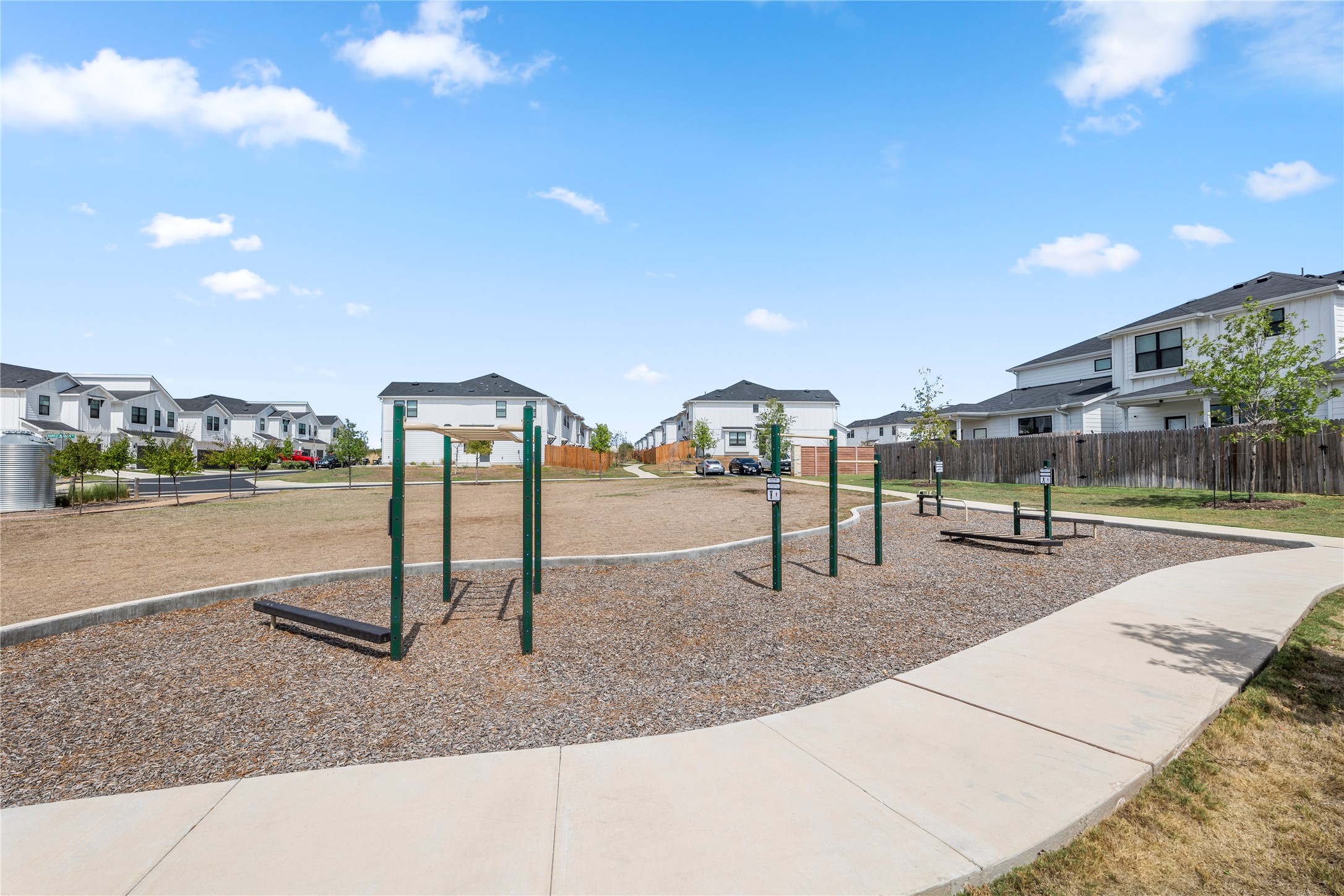 125 Threshing Road, Unit A Buda, TX 78610 - Photo 21 of 23 Community playground featuring a residential view