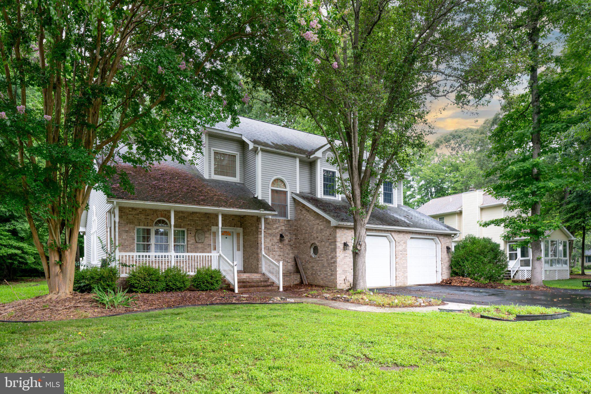 36314 Old Mill Pond Road Selbyville, DE 19975 - Photo 1 of 45 Charming home nestled in lush greenery.