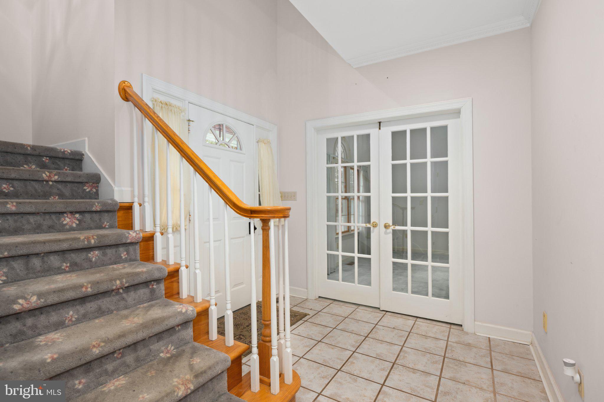 36314 Old Mill Pond Road Selbyville, DE 19975 - Photo 18 of 45 Inviting entryway with elegant staircase.